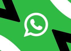 Ilustrasi logo WhatsApp di atas latar hijau